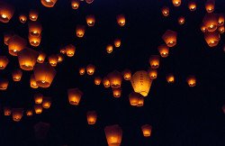 Sky lanterns in night sky
